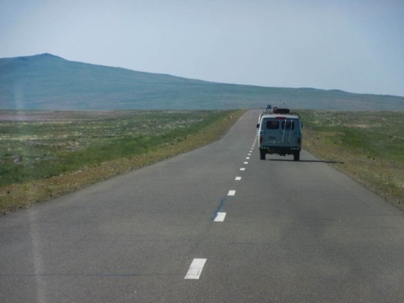 Russian 4WD van driving through the Gobi desert.