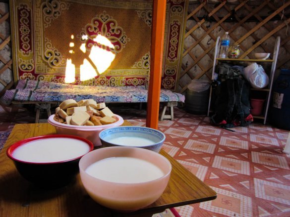 Inside of a ger with local snacks on the table